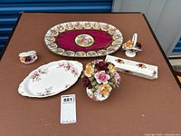 Full set of Royal Albert china items including platter, porcelain flowers, oval serving dish, small rectangular tray, and small dish