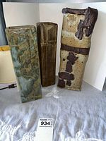 All three pottery vases shown together displaying size and color differences.