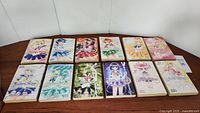 Photo showing all 12 volumes of Pretty Guardian Sailor Moon manga by Kodansha Comics laid out in two rows with colorful anime character covers.