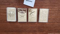 Overview of all four gold plated Pokemon bars in protective plastic cases