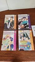 Top down photo of four manga volumes by Yuu Moegi titled Private Teacher, volumes 1 to 4, with colorful illustrated covers showing male characters.