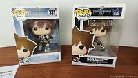 Two Funko Pop boxes side by side, showing Sora figures 331 and 620