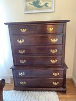 Full view of the two-piece Chippendale style dresser showing all six drawers with brass handles.