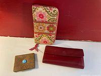 Set of 3 wallets: Vera Bradley fabric zippered wallet, red Derek Alexander leather wallet, small gold embossed metal case