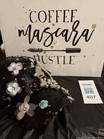 Hat in front of sign showing both items together