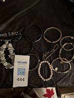 Group shot of all bracelets on black surface