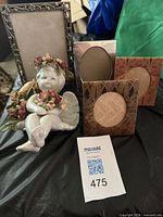 Group shot showing angel figurine and all four frames