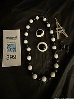 Entire set laid out showing necklace, earrings and brooch pieces