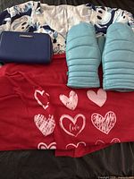 Wallet, top, mittens, bottoms laid out