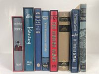 Front view of all 8 Folio Society books showing spines with titles and authors.
