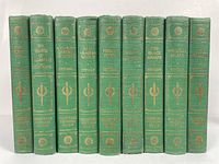 Front view of 9 green hardcover books with gold text on spines, Titles by Stevenson.