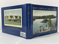 Front and back cover of the hardcover book showing vintage postcard illustrations and title