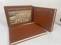 Two hardcover volumes and cloth slipcase with gilt title 'Canadian Watercolours and Drawings in The Royal Ontario Museum'. Showcases covers and set presentation.