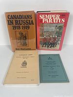 Front view of four Canadian military history books showing cover titles and images.