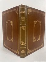 Front and back cover with gold embossed details and title on spine