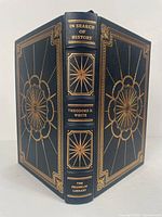 Front and back cover of the Franklin Library leather bound book showing detailed gold embossing and title on spine.