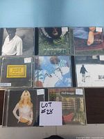 First photo showing 8 different CD covers including Kaiser Chiefs, Phil Keaggy, and Sheryl Crow.
