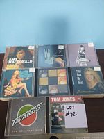 Photo of 6 CDs in cases including Amy Macdonald, Suzie McNeil, Tavares, Tom Jones, and others