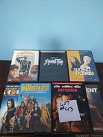 Photo of first six DVDs including The Long Kiss Goodnight, Sound Tap, Sliding Doors, Wanderlust, City of Chelsea and one partially shown item