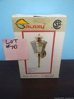 Photo of original cardboard box packaging for Galaxy branded outdoor patio light with image of the lantern on front and branding.