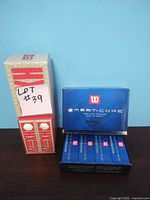 Photo of Wilson Smart-Core golf ball box and Hi Red Piece golf ball packs