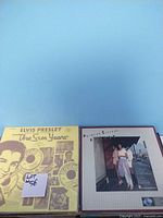 Elvis Presley "The Sun Years" album cover in folder, shows collection note