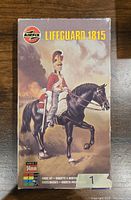 Front view of the Airfix Lifeguard 1815 model kit box featuring artwork of a mounted Lifeguard soldier with red uniform on black horse.