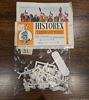 Plastic miniature kit pieces inside a clear plastic bag with a paper label showing the Historex logo and kit details for Mamluks kettledrummer 1805-1815.