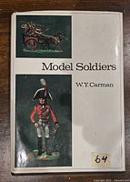 Front cover of the Model Soldiers book by W.Y. Carman showing two painted model soldier images and the book title and author name.