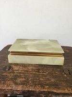 Closed view of the rectangular green hard stone dresser box showing polished smooth surface and natural stone pattern.