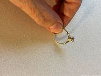 Ring held sideways showing profile and band shape