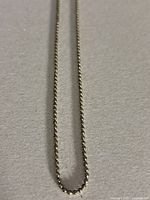 Close-up of the sterling silver bead chain section, showing small spherical beads.