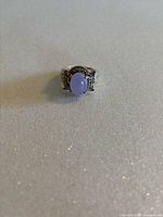 Front view of ring showing lavender jade cabochon and marcasite details.