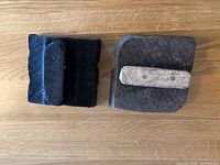 Two wooden textile printing blocks showing the wooden handles on back sides.