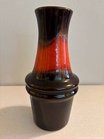 Front view photo of Scheurich ceramic vase showing flared neck and red-brown-black glaze.