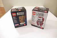 Front view of both LEGO BrickHeadz boxes Groot 40671 and Iron Man 40669