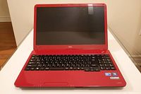 Laptop open showing keyboard and screen