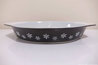 Side profile showing black exterior and snowflake pattern