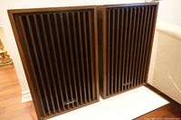 Front view of both Panasonic 8840 speakers showing slatted grills and badges