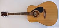 Full front view of Yamaha F-310 acoustic guitar