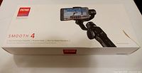 Retail box showing Zhiyun Smooth 4 product image and branding