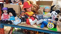Overall lot showing dolls, monkeys, teddy bears, magazines, panda drum toy