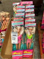 Set of 5 petite fashion dolls in original packaging with pink and green outfit variations.