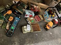 Overhead shot of assorted toy vehicles on concrete floor