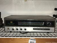 Front view of Electrophonic receiver showing tuning dial, control knobs, and buttons.