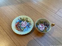 Teacup and saucer overview on wooden surface