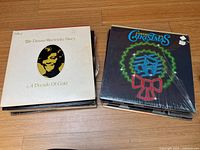Photo showing stacks of 12-inch vinyl records including Dionne Warwick Story: A Decade Of Gold and Murray Christmas albums.