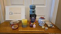 Full lot showing the wax melter, assorted candles, wax melts, and jar candle