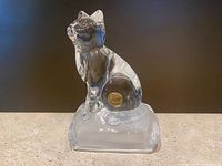 Cat figurine in clear lead crystal sitting on a smooth base.
