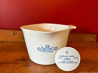 Corning Ware Blue Cornflower P-55-B 32 oz. saucepan showing bottom maker's mark and Blue Cornflower pattern on white Pyroceram.